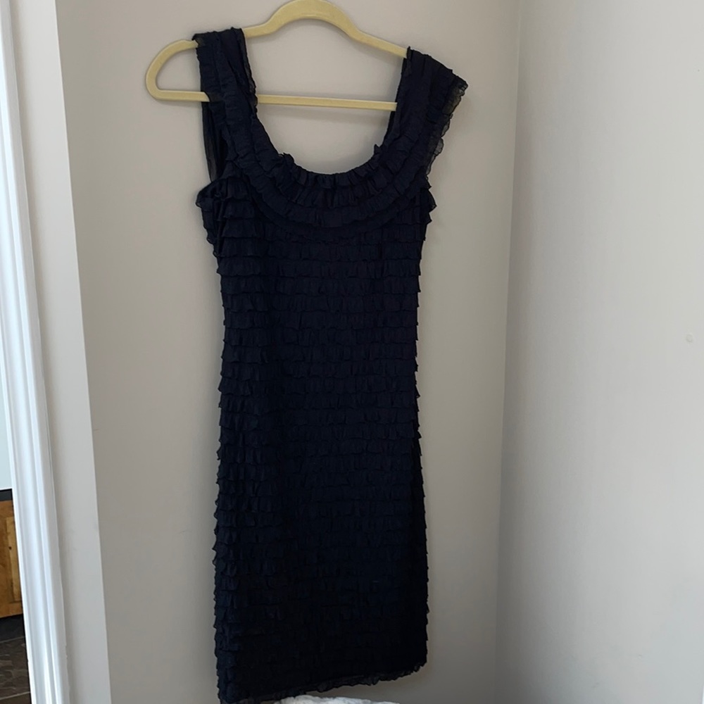 Knee length black sleeveless dress